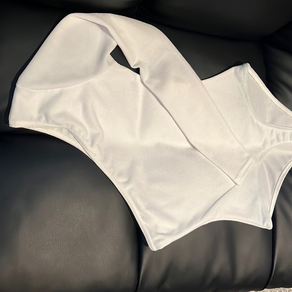 One shoulder white bodysuit.